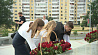 Цветы к стеле "Минск - город-герой" приносят представители общественных организаций, трудовые коллективы, молодежь